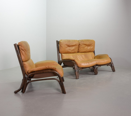 Image 1 of Brutalist Bentwood Loveseat Bamboo Sofa and Lounge Chair with Caramel Leather Upholstery, 1960s. 