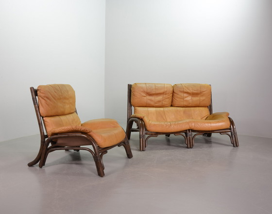 Image 1 of Brutalist Bentwood Loveseat Bamboo Sofa and Lounge Chair with Caramel Leather Upholstery, 1960s. 