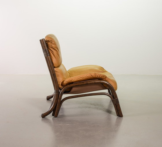 Image 1 of Brutalist Bentwood Loveseat Bamboo Sofa and Lounge Chair with Caramel Leather Upholstery, 1960s. 