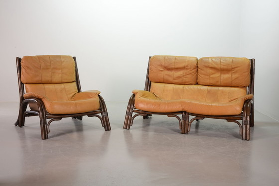 Image 1 of Brutalist Bentwood Loveseat Bamboo Sofa and Lounge Chair with Caramel Leather Upholstery, 1960s. 