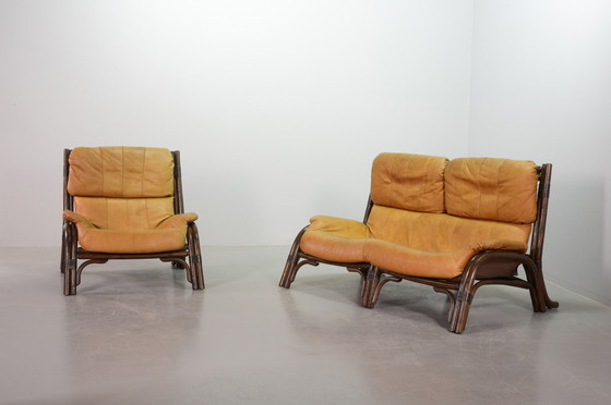 Image 1 of Brutalist Bentwood Loveseat Bamboo Sofa and Lounge Chair with Caramel Leather Upholstery, 1960s. 