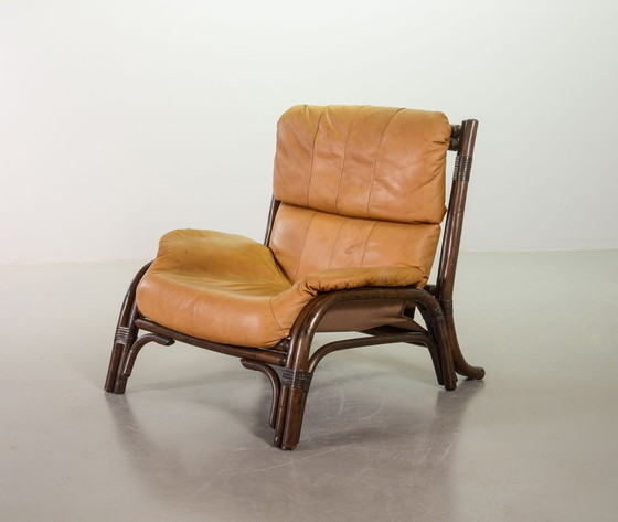 Image 1 of Brutalist Bentwood Loveseat Bamboo Sofa and Lounge Chair with Caramel Leather Upholstery, 1960s. 