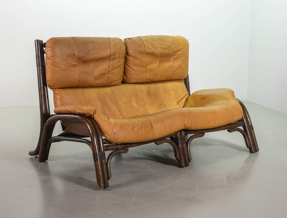 Image 1 of Brutalist Bentwood Loveseat Bamboo Sofa and Lounge Chair with Caramel Leather Upholstery, 1960s. 