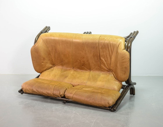 Image 1 of Brutalist Bentwood Loveseat Bamboo Sofa and Lounge Chair with Caramel Leather Upholstery, 1960s. 