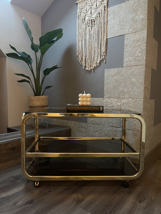 Bar trolley made of brass with smoked glass, castors, extendable