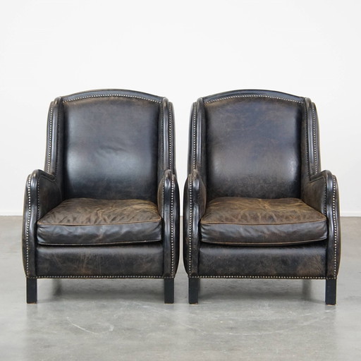 2 X Black Beef Leather Armchair With A High Back And With Decorative Nails