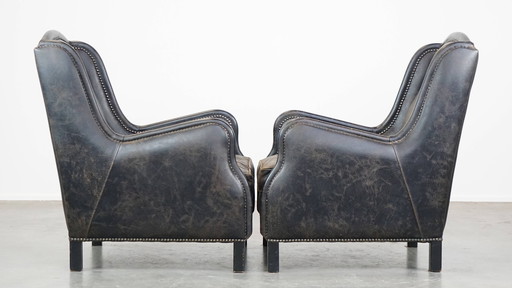 2 X Black Beef Leather Armchair With A High Back And With Decorative Nails