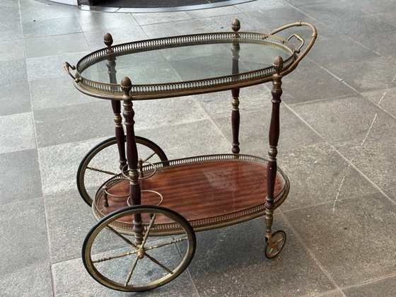 Image 1 of Neoclassical Oval Scroll Table Of Brass And Mahogany With Double Removable Trays. French Work Of The Maison Baguès. Circa 1940.