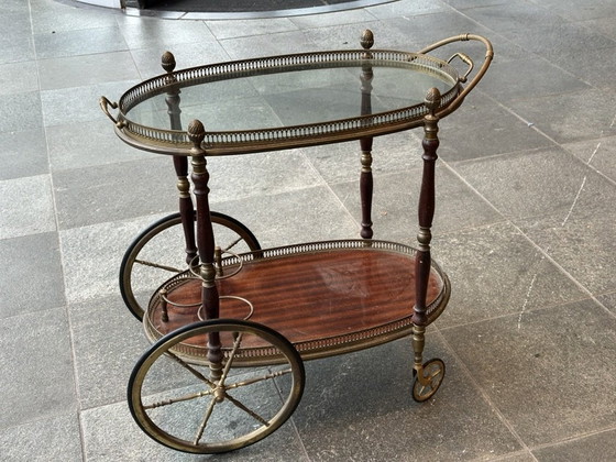 Image 1 of Neoclassical Oval Scroll Table Of Brass And Mahogany With Double Removable Trays. French Work Of The Maison Baguès. Circa 1940.