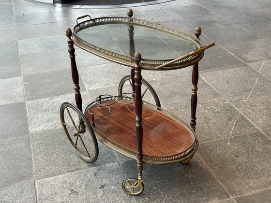 Image 1 of Neoclassical Oval Scroll Table Of Brass And Mahogany With Double Removable Trays. French Work Of The Maison Baguès. Circa 1940.