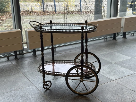 Image 1 of Neoclassical Oval Scroll Table Of Brass And Mahogany With Double Removable Trays. French Work Of The Maison Baguès. Circa 1940.