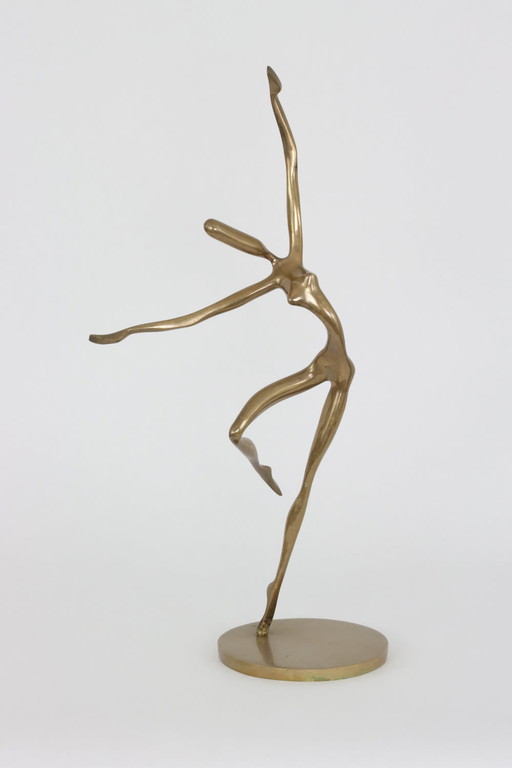 A bronze statue of a dancer by Yves Lohé