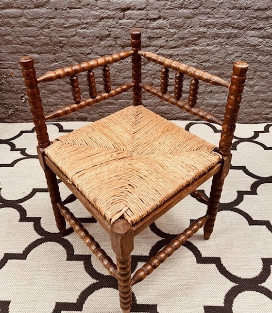 Image 1 of Vintage Brutalist Bobbin Oak Corner Chair With Braided Piping Seat