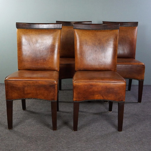 Set of four sheep leather dining room chairs in Art Deco style