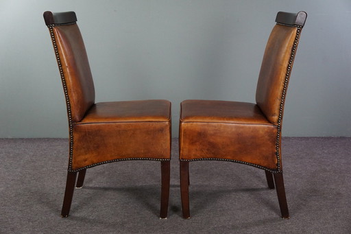 Set of four sheep leather dining room chairs in Art Deco style