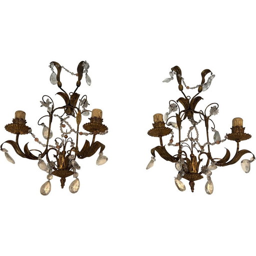 Pair of gilded metal and crystals wall sconces. French work in the style of Maison Baguès