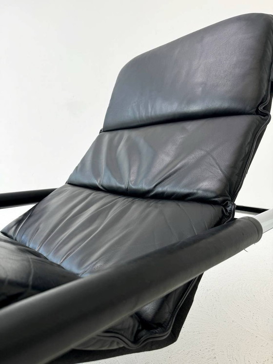 Image 1 of Designer lounger in black leather with tubular metal frame