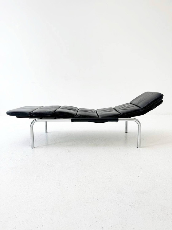 Image 1 of Designer lounger in black leather with tubular metal frame