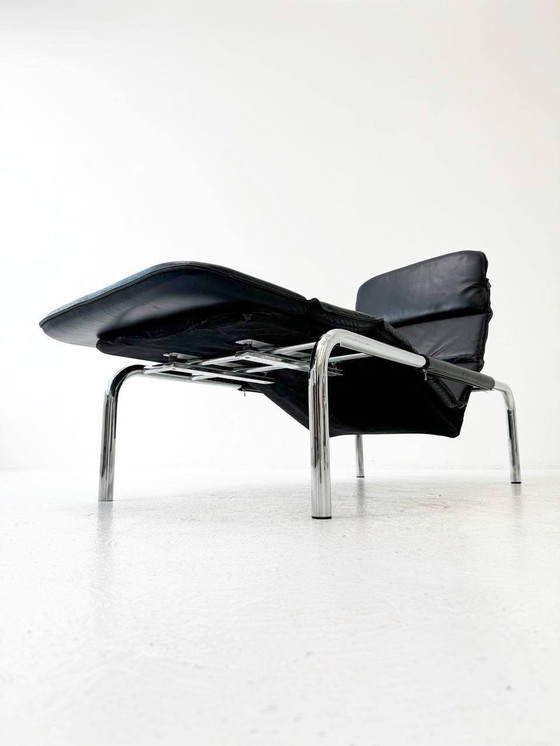 Image 1 of Designer lounger in black leather with tubular metal frame