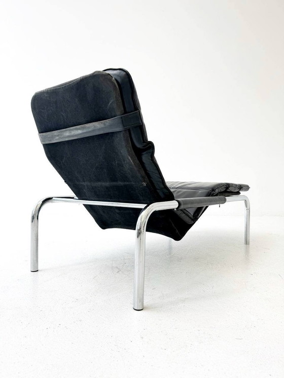 Image 1 of Designer lounger in black leather with tubular metal frame