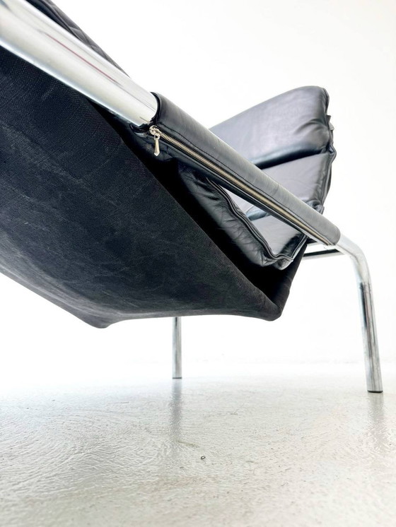 Image 1 of Designer lounger in black leather with tubular metal frame