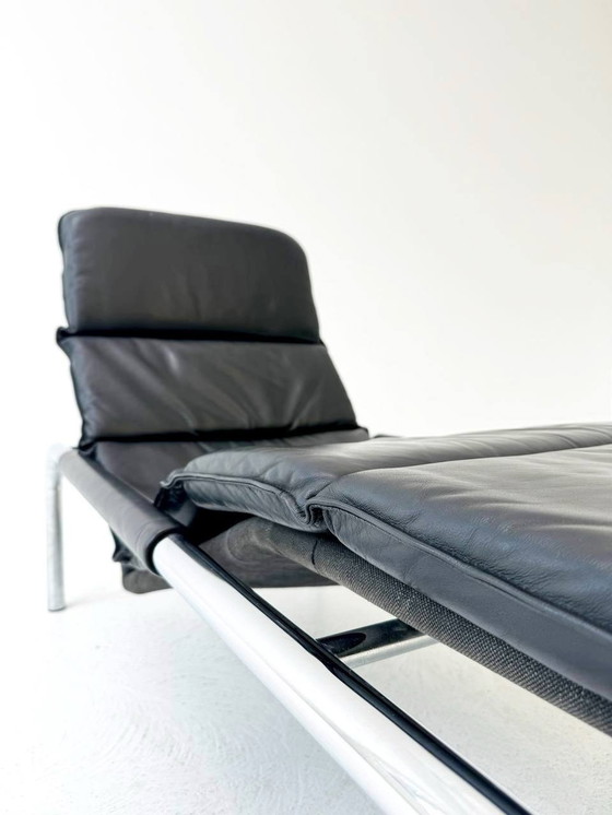 Image 1 of Designer lounger in black leather with tubular metal frame