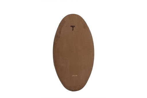 Oval-shaped mirror set with a gilded brass rod. Circa 1970.