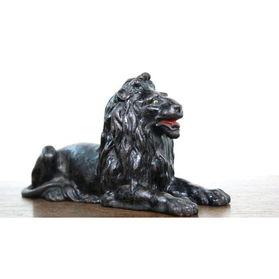 Image 1 of Vintage cast iron lying lion