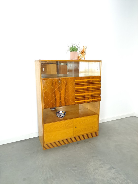 Image 1 of Veneer bar cabinet with round shapes and mirror wall