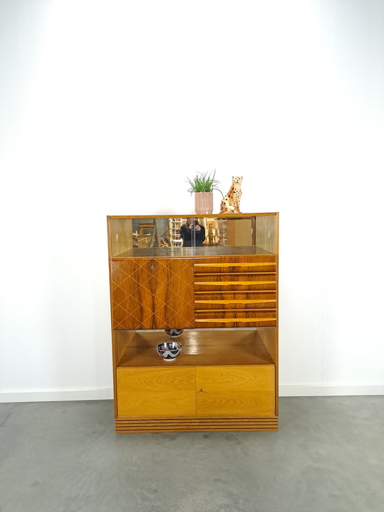 Image 1 of Veneer bar cabinet with round shapes and mirror wall