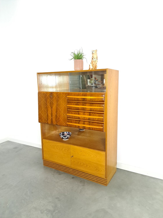 Image 1 of Veneer bar cabinet with round shapes and mirror wall