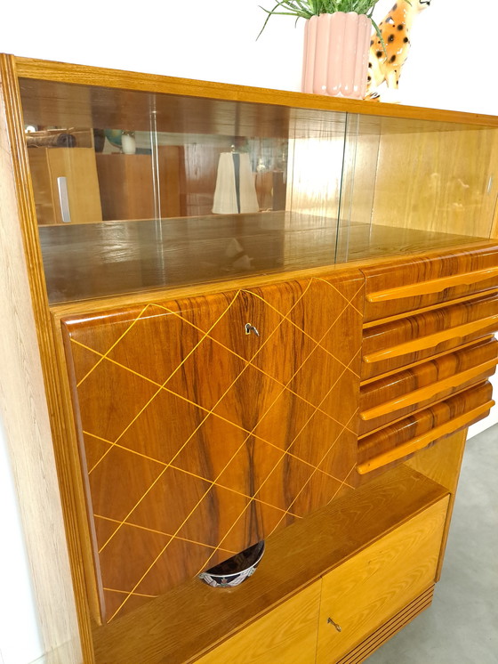 Image 1 of Veneer bar cabinet with round shapes and mirror wall