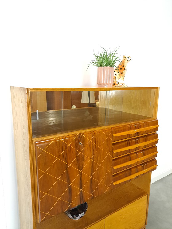 Image 1 of Veneer bar cabinet with round shapes and mirror wall