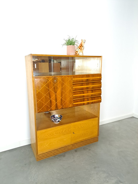 Image 1 of Veneer bar cabinet with round shapes and mirror wall