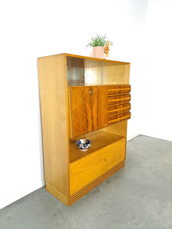 Image 1 of Veneer bar cabinet with round shapes and mirror wall