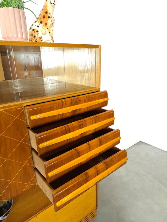 Image 1 of Veneer bar cabinet with round shapes and mirror wall