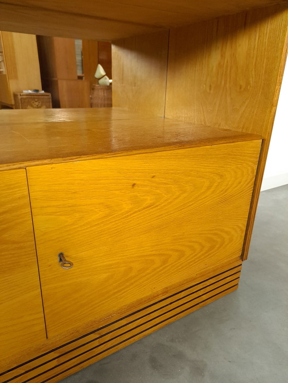 Image 1 of Veneer bar cabinet with round shapes and mirror wall