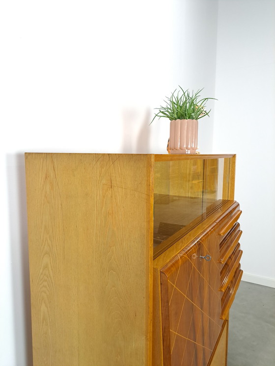 Image 1 of Veneer bar cabinet with round shapes and mirror wall