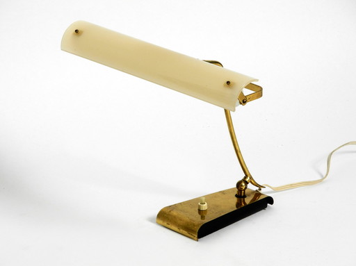 Mid Century Modern brass desk lamp with a plexiglass shade and plug-in bulb