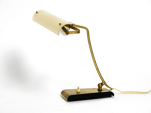 Mid Century Modern brass desk lamp with a plexiglass shade and plug-in bulb