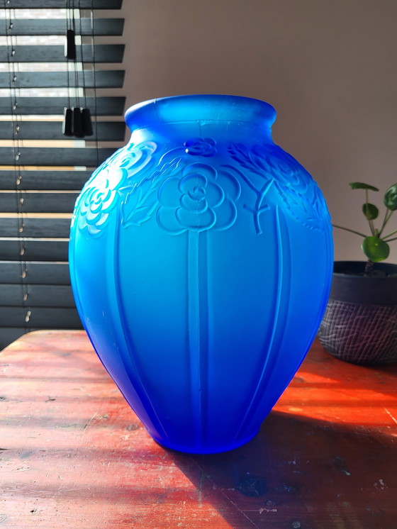 Image 1 of Art deco vase in frosted blue pressed glass with floral decor and tight lines relief