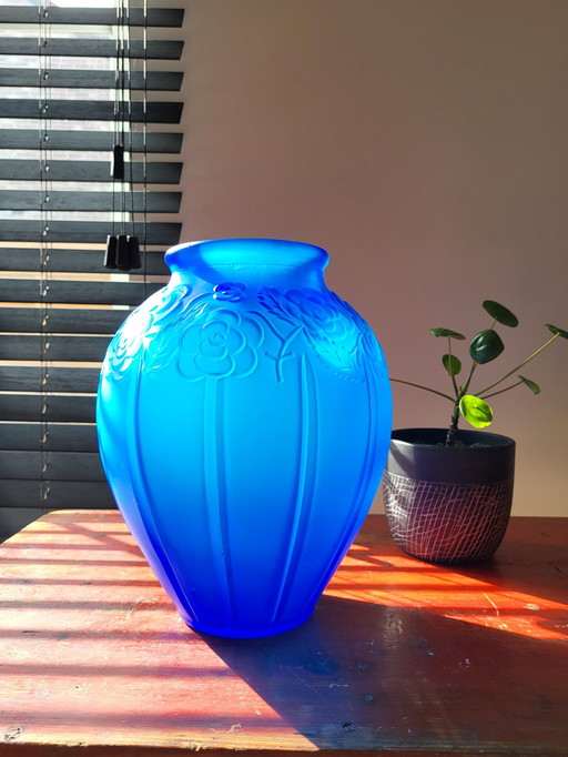 Art deco vase in frosted blue pressed glass with floral decor and tight lines relief