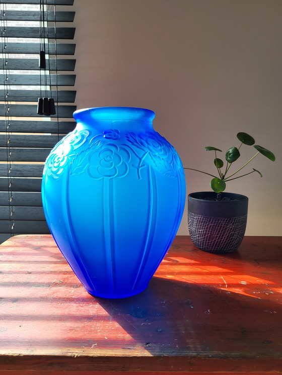 Image 1 of Art deco vase in frosted blue pressed glass with floral decor and tight lines relief