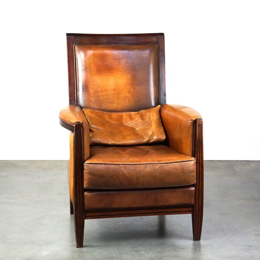 Sheep leather Art Deco design armchair with high back and wood finish