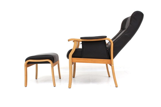 Image 1 of as new, 1 of 2 danish Nordic Easy Lounge Chair / Relax Sessel with stool in oak and leather.