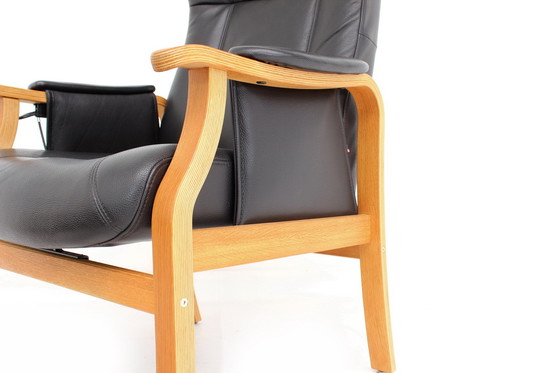 Image 1 of as new, 1 of 2 danish Nordic Easy Lounge Chair / Relax Sessel with stool in oak and leather.