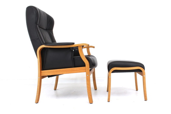 Image 1 of as new, 1 of 2 danish Nordic Easy Lounge Chair / Relax Sessel with stool in oak and leather.