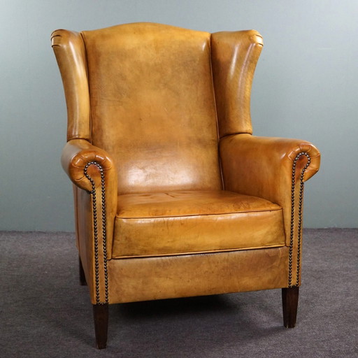 Blonde cowhide leather wing chair