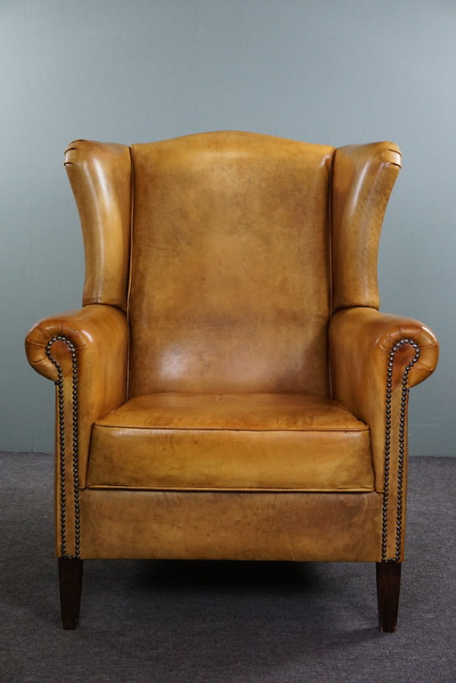 Blonde cowhide leather wing chair