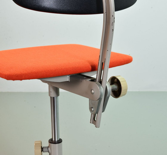 Image 1 of Ahrend De Cirkel industrial office chair with orange fabric upholstery on a gray steel frame. Netherlands, 1950s. Ref.: CH19